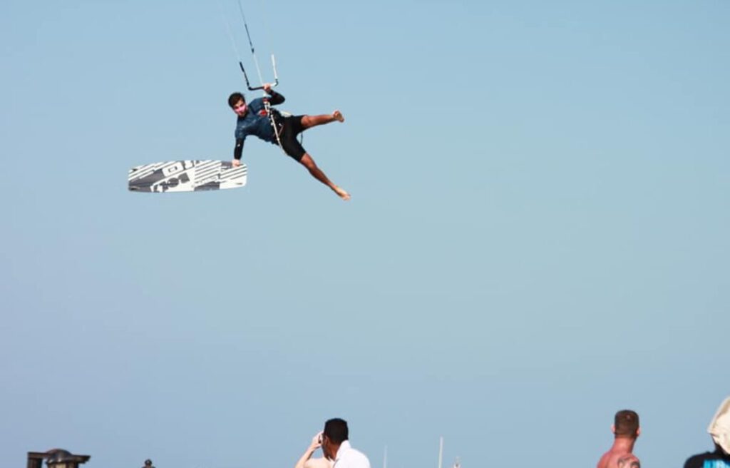 Kitesurfer jumping high above the lagoon in Hurghada