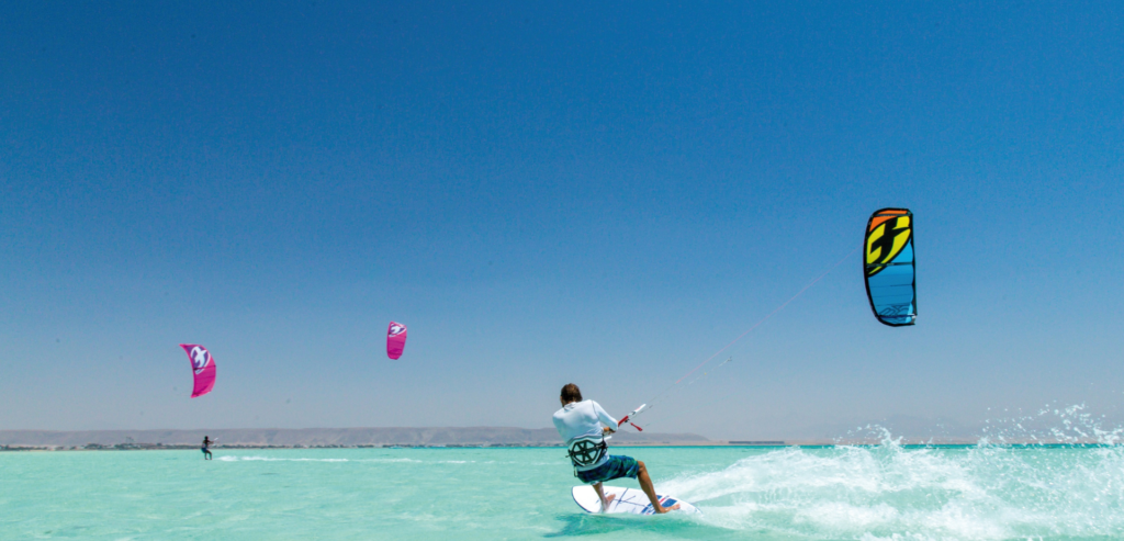 Kitesurfer riding the turquoise flat-water lagoon at Sultan Kite School, Hurghada