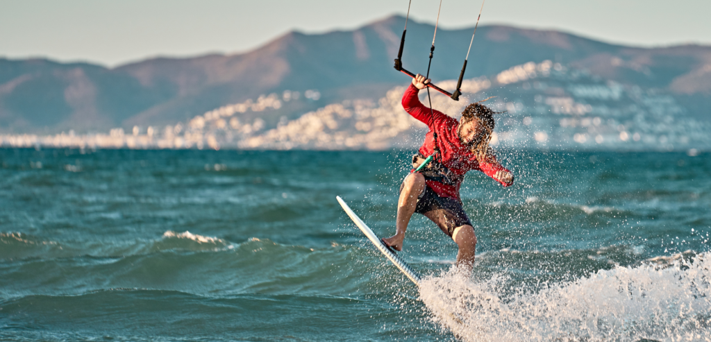 Kitesurfer riding the bay with the Red Sea mountains behind, Hurghada