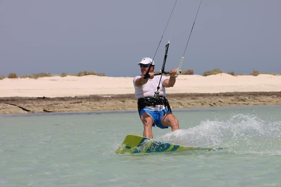 Kitesurfer riding over a shallow lagoon on a Red Sea kite safari